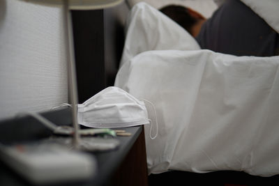 Close-up of book on bed at home
