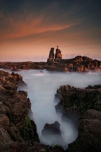 Scenic view of sea at sunset