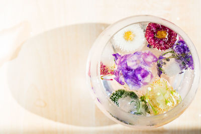 High angle view of flowers in bowl on table