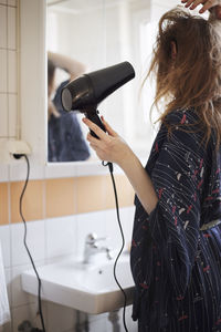 Woman drying hair