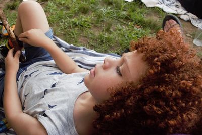 High angle view of cute sitting on field