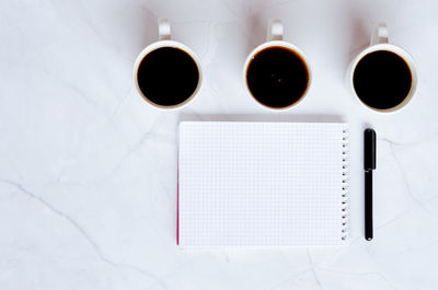 Directly above shot of coffee cup on table