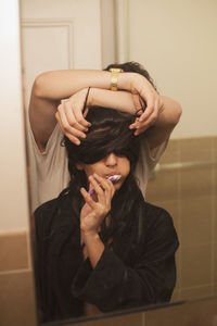 Young woman brushing her teeth