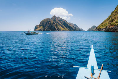 Scenic view of sea against blue sky