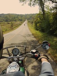 Man riding bicycle on road