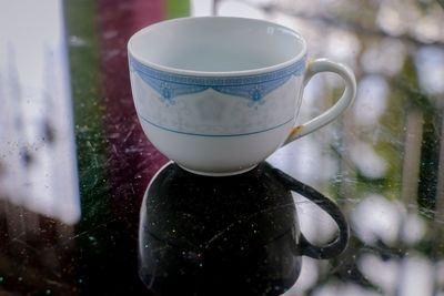 Close-up of coffee cup on table