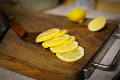 Close-up of sliced lemon on cutting board