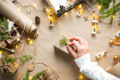 High angle view of woman holding christmas decoration