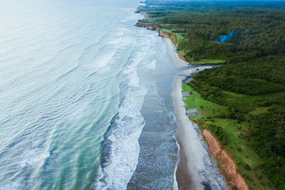 High angle view of surf on beach