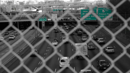 Cityscape seen through chainlink fence