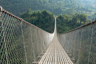 View of footbridge in forest