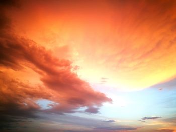 Low angle view of cloudy sky at sunset