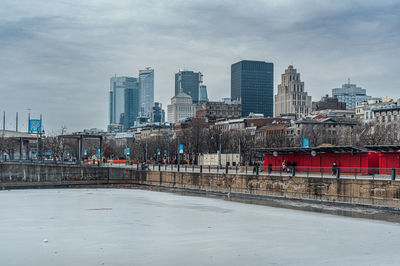 Buildings in city against sky