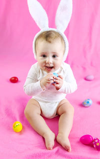 Portrait of cute girl playing with toys on table