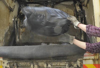 Midsection of woman working in water