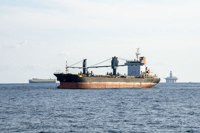 View of ship in sea against sky