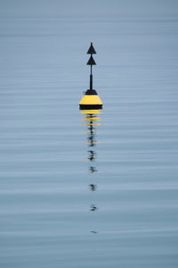 Reflection of buoy in water