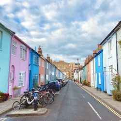 Pastel houses on brighton street with parked bikes