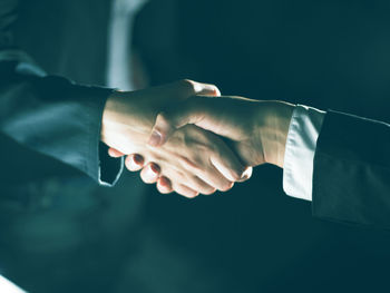 Close-up of hands holding ball