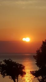 Scenic view of sea against romantic sky at sunset