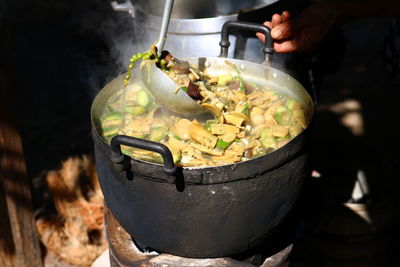 Close-up of human hand preparing food