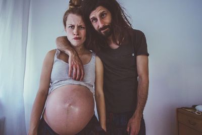 Portrait of young couple at home