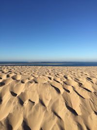 Scenic view of desert against clear sky