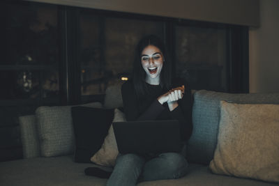 Portrait of young woman wearing mask