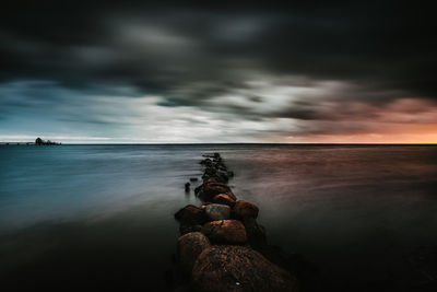 Scenic view of sea against sky during sunset