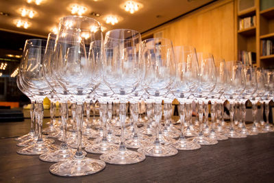 Close-up of wine glasses on table