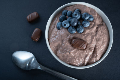 Traditional finnish foods - closeup of a bowl of chocolate porridge with blueberry topping