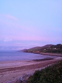 Scenic view of sea against sky at sunset