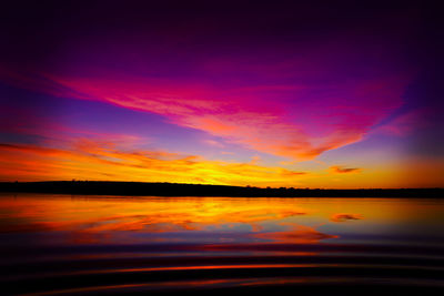 Scenic view of lake against romantic sky at sunset