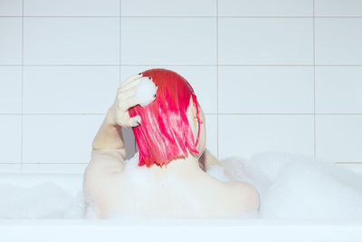 Naked woman in sink