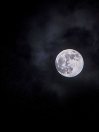 Low angle view of moon against sky at night