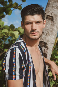 Portrait of young man standing outdoors