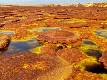 Colorful sulphur rock ponds in danakil depression, ethiopia.