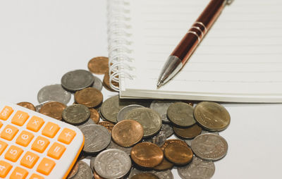 High angle view of coins on table