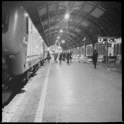 People walking on railroad station platform