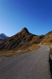 Scenic view of mountains against clear blue sky