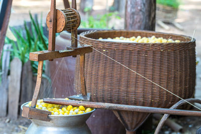 Close-up of fruits in basket at market stall