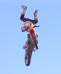 Low angle view of airshow against clear blue sky