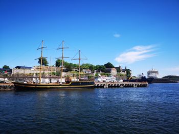 Ship in sea against blue sky