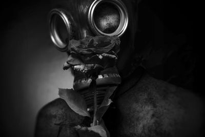 Close-up of man wearing gas mask