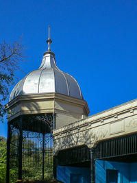 Low angle view of dome against clear blue sky