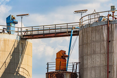 Low angle view of factory against sky