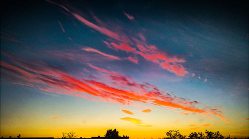 Low angle view of dramatic sky during sunset