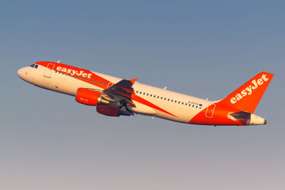 Low angle view of airplane against clear sky