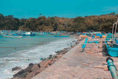 Scenic view of beach against blue sky