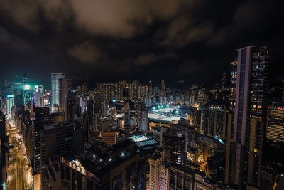 Aerial view of city lit up at night